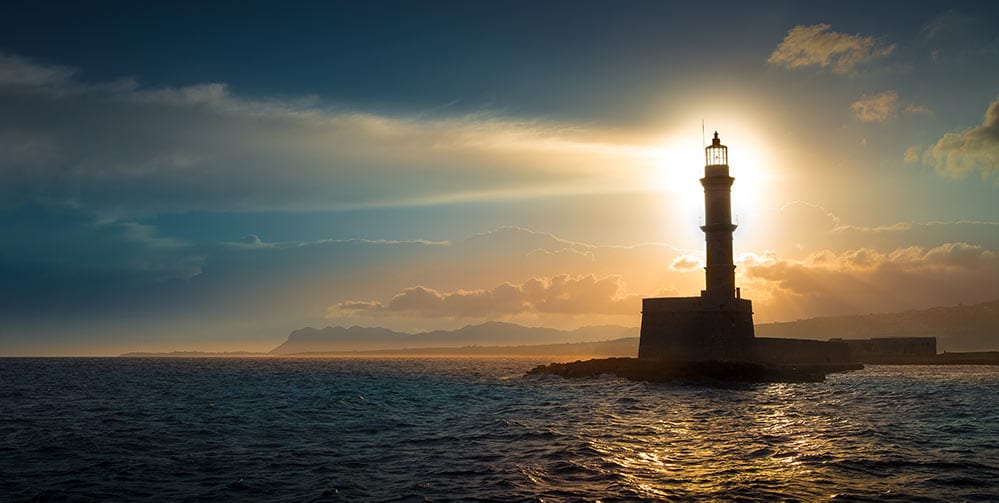 lighthouse with light shining at