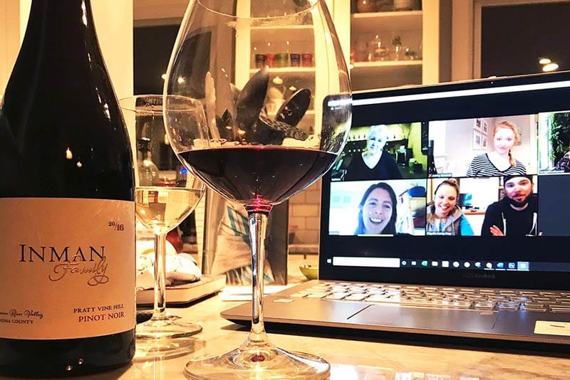 friends connecting doing a wine tasting on zoom