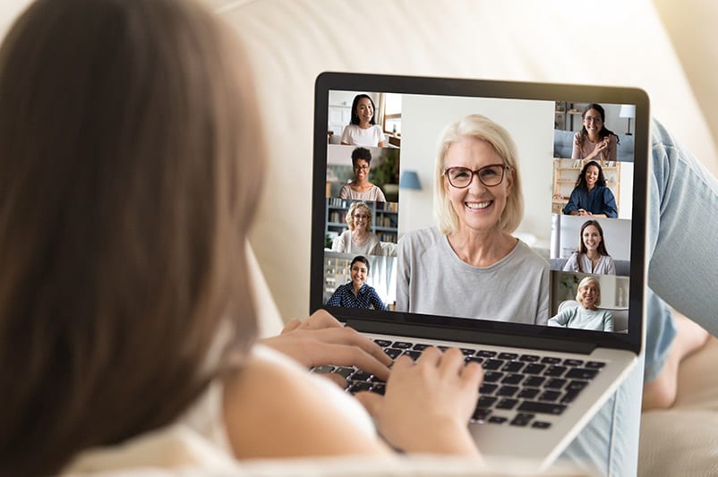 Woman connecting with friends on zoom
