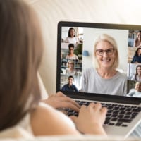 Woman connecting with friends on zoom