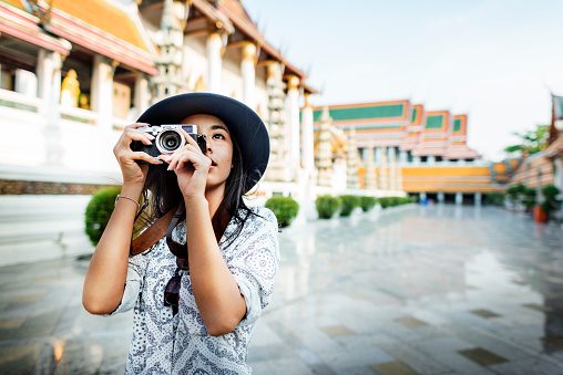 female tourist taking pictures