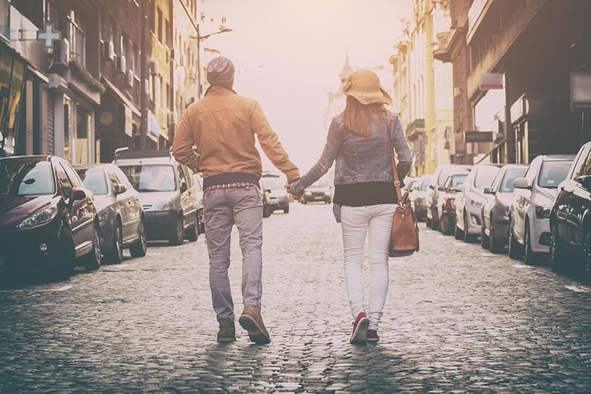 Couple in love walking through the city streets.