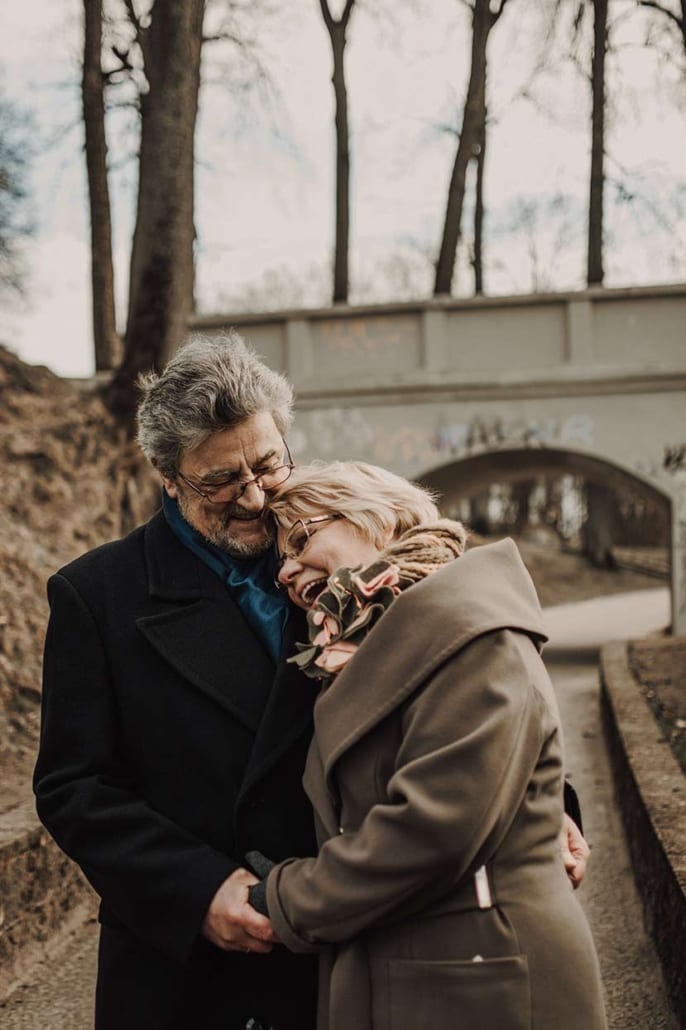 Esther Perel suggests that creating space is key to eroticism. This happy mature couple walking through a city.