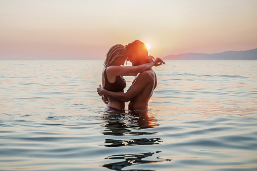 Couple, twin flame soulmates, in the water.