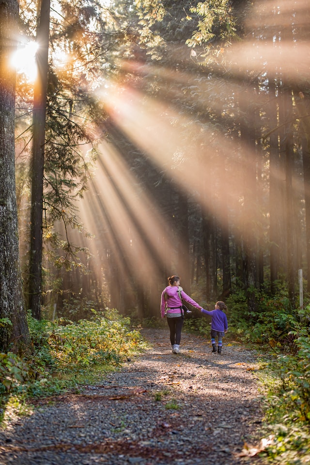 Woman and child walking along a spring day. Photo by James Wheeler on Unsplash